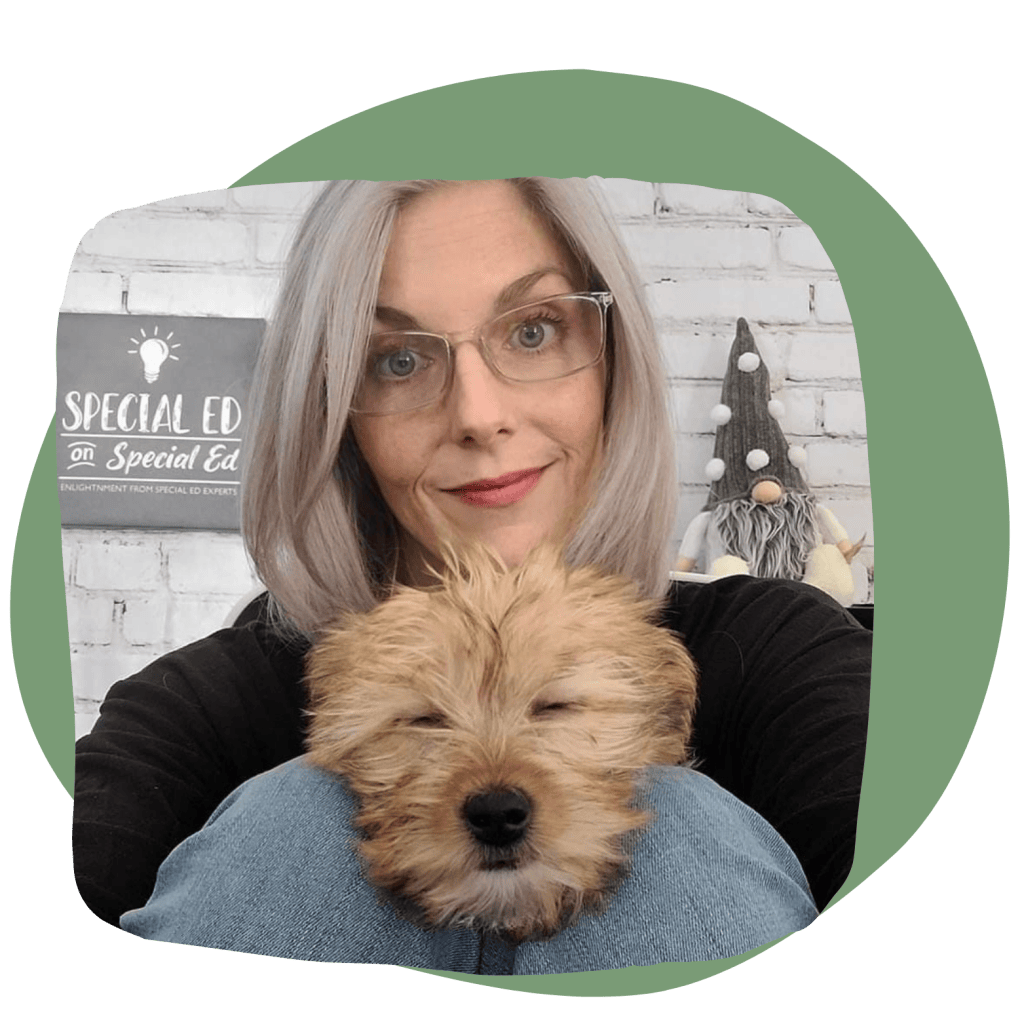 Dana Jonson in her recording studio holding her dog Roscoe, with the Special Ed on Special Ed sign behind her